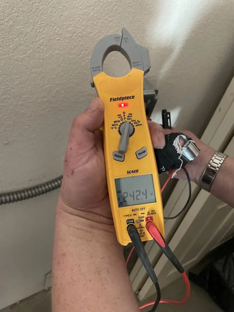 Voltage testing with clamp meter during Whole House Surge Protector in Bloomington